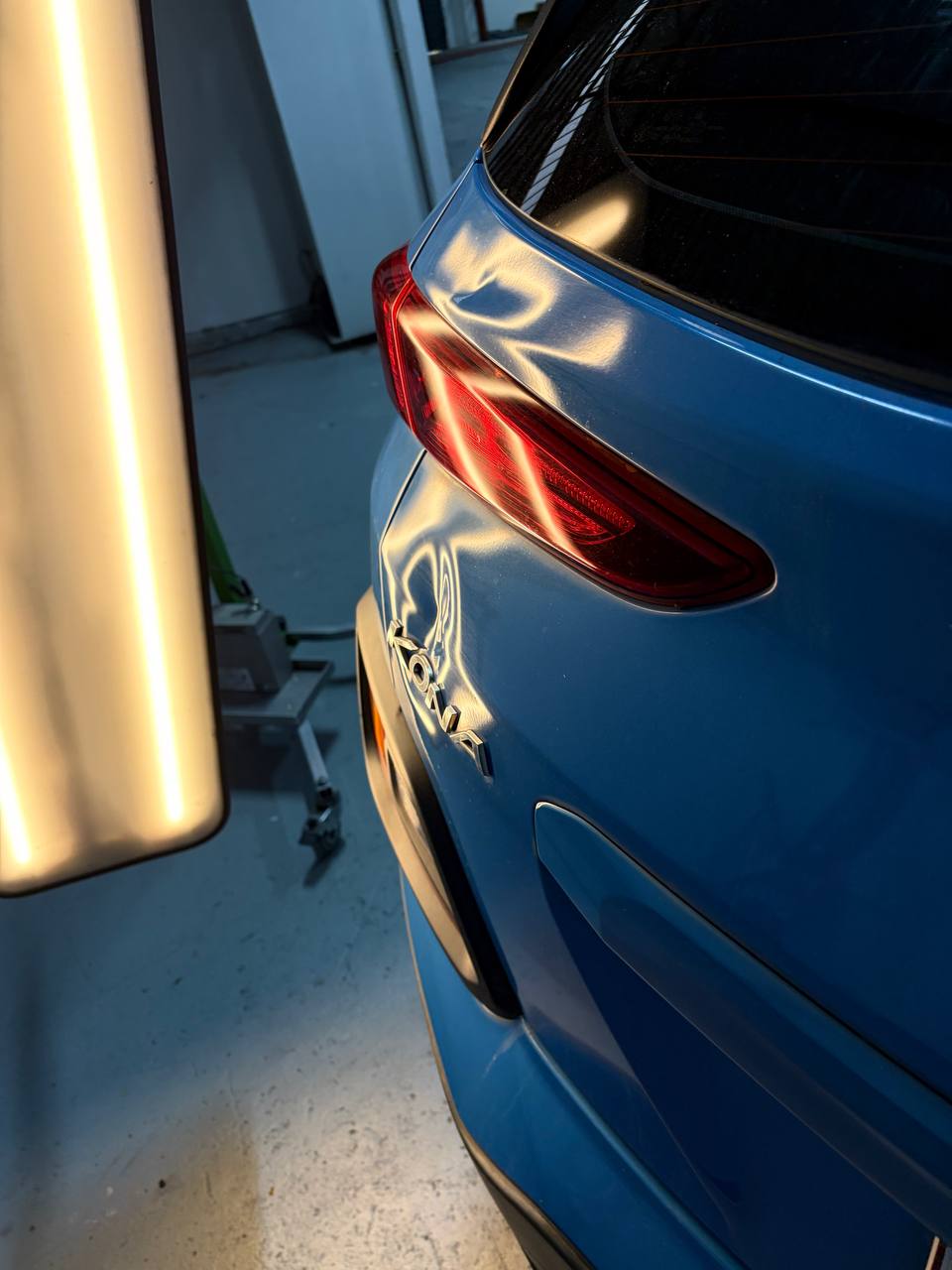 Hyundai Kona tailgate dent beside the tail light before paintless dent repair