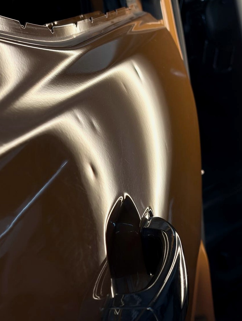 Body-line door dent before assessment for paintless dent repair